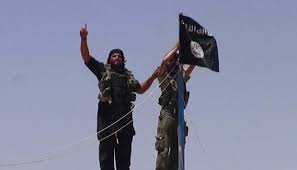 ISIS soldiers hoisting the flag